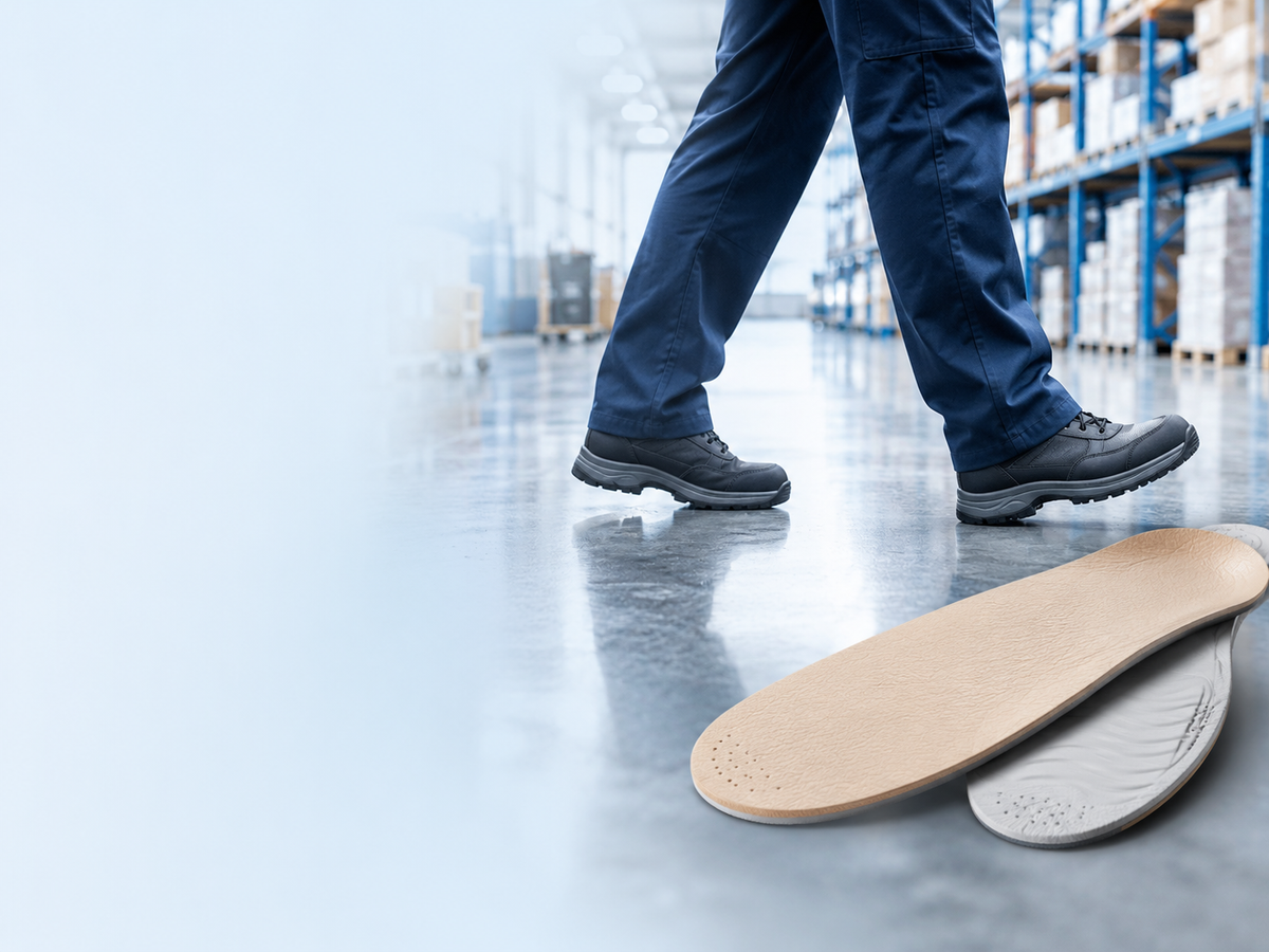 Warehouse worker walking in work shoes on a concrete floor